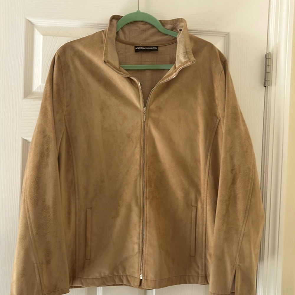 Women’s faux suede in a tan color and lined in a plaid in a size XL